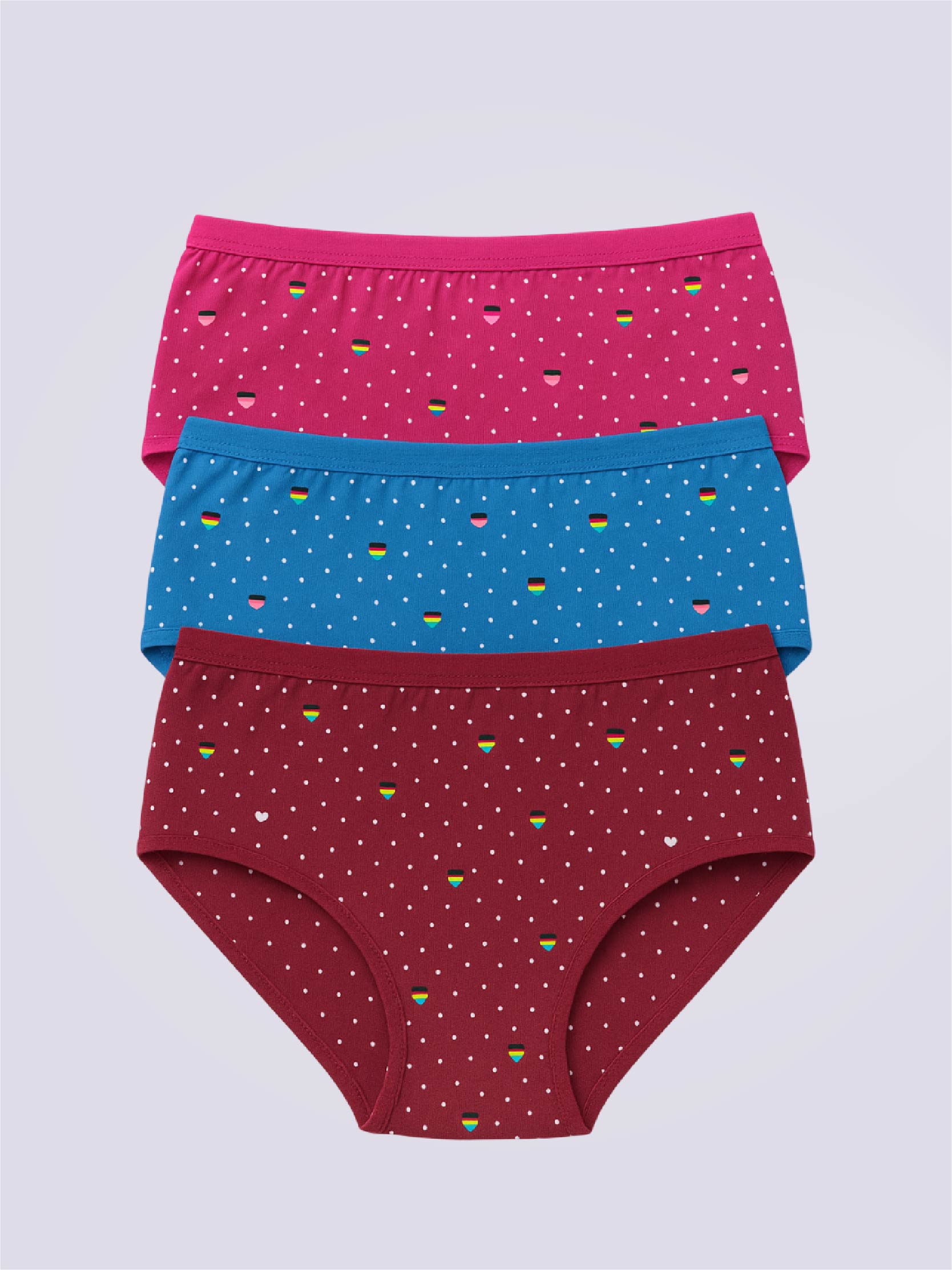 Three pairs of colorful printed underwear with a pattern on a light gray background