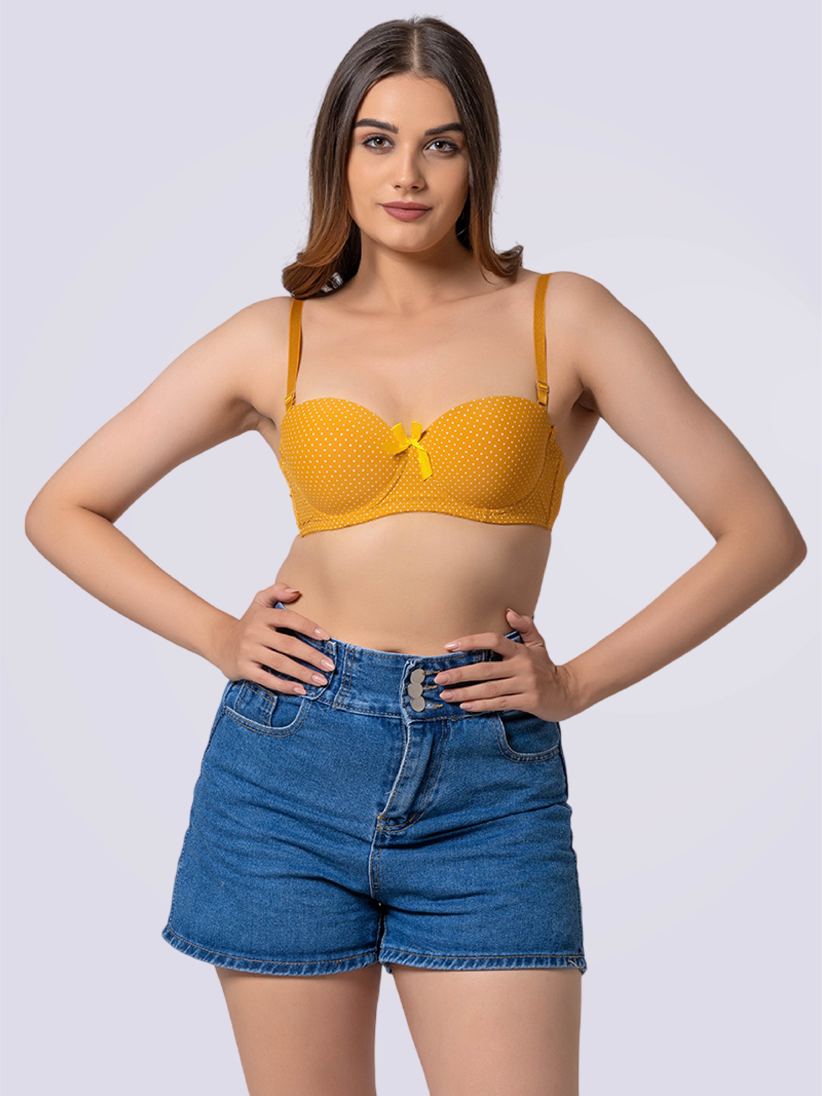 This image features a vibrant, yellow Dashing Dot Lightly Padded Underwired Demi Cup Bra, showcased on a woman. The bra is adorned with playful, black polka dots, adding a whimsical touch to its design.