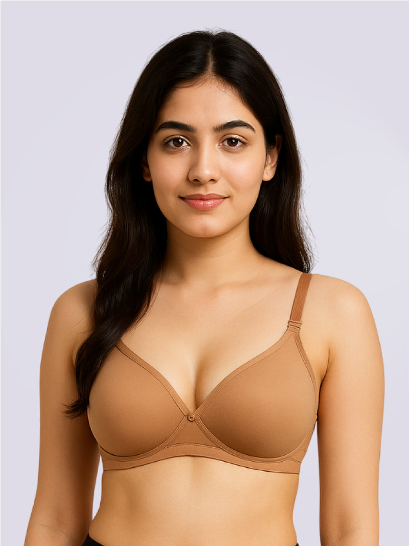 Woman wearing a brown bra against a light gray background