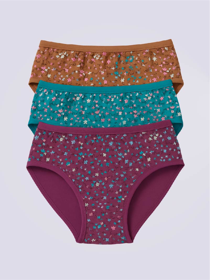 Three pairs of floral-patterned underwear in purple, green, and brown on a light purple background.